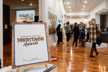 Heritage awards sign left and people in background