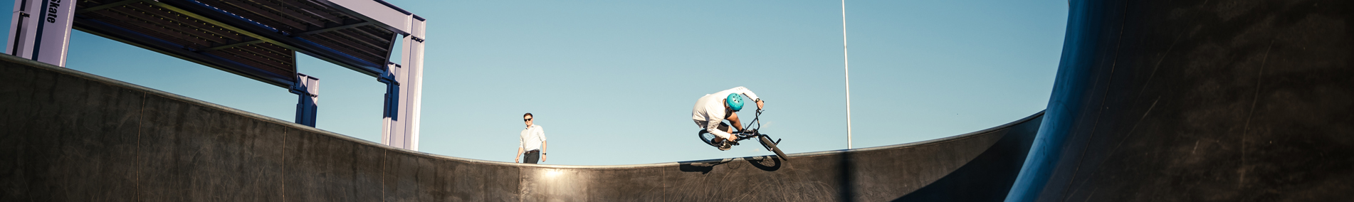 Man on pushbike in skate bowl