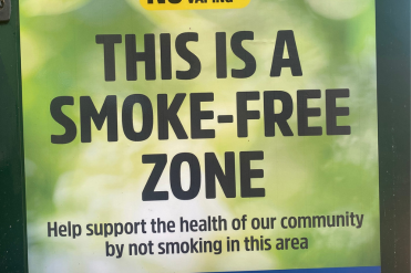 An image of an existing sign detailing that this area is a smoke-free zone. 