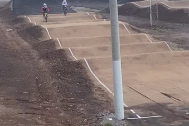 Two BMX riders racing over the finish line at the newly upgraded BMX track