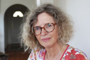 Author Rosamund Burton smiling at camera